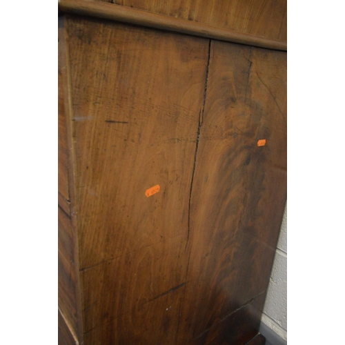 1214 - A VICTORIAN FLAME MAHOGANY LINEN PRESS, overhanging cornice, the double panelled doors enclosing thr... 