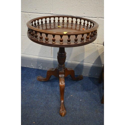 1223 - A REPRODUCTION MAHOGANY CIRCULAR WINE TABLE with a spindled gallery and an oval mahogany nest of thr... 