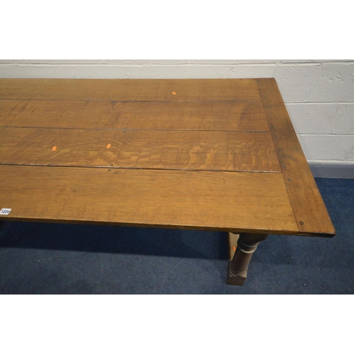 1224 - A REPRODUCTION OAK REFECTORY TABLE, in the 18th century style, the plank top on turned and block leg... 