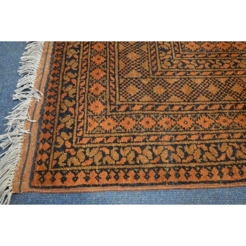 1232 - A HAND WOVEN NAHZAT RUSSET GROUND RUG, 250cm x 166cm