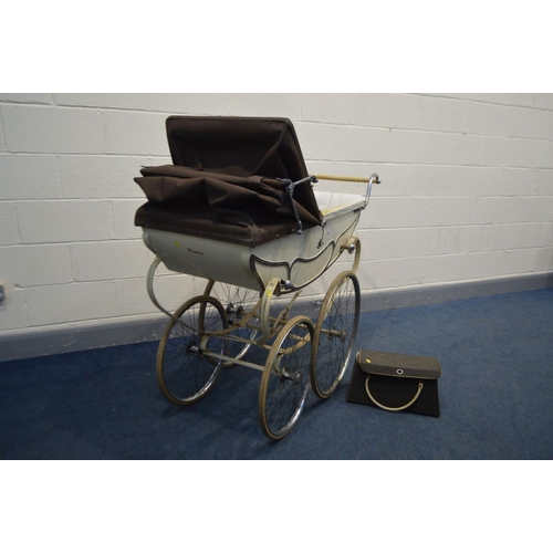 1233 - A VINTAGE MANTON PRAM/PERAMBULATOR, with carry case and attachable umbrella (condition - leather str... 