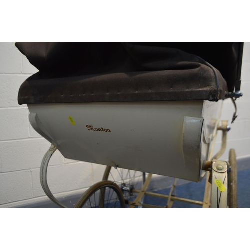 1233 - A VINTAGE MANTON PRAM/PERAMBULATOR, with carry case and attachable umbrella (condition - leather str... 