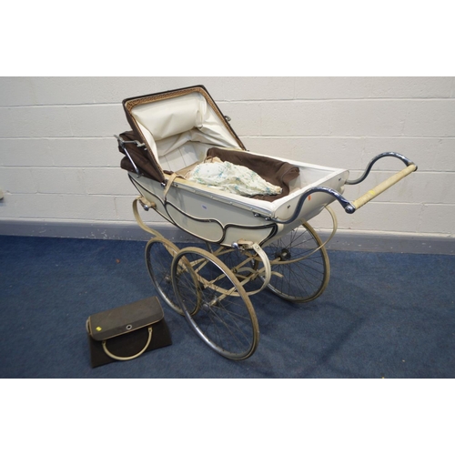 1233 - A VINTAGE MANTON PRAM/PERAMBULATOR, with carry case and attachable umbrella (condition - leather str... 