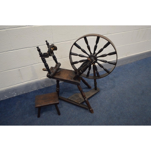 1237 - AN OAK SPINNING WHEEL constructed from repurposed Georgian and later timbers together with a foot st... 