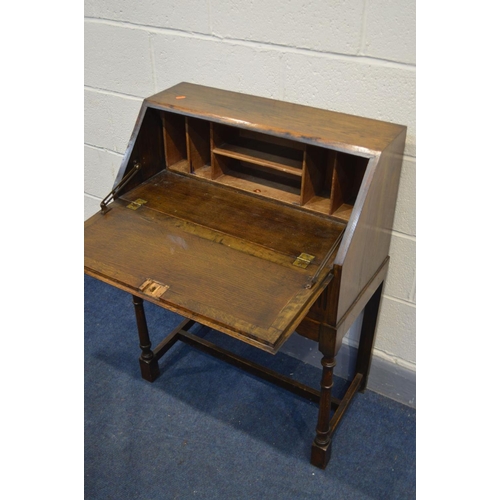 1244 - AN EARLY TO MID 20TH CENTURY BUREAU, with a single drawer, on turned legs united by a single stretch... 