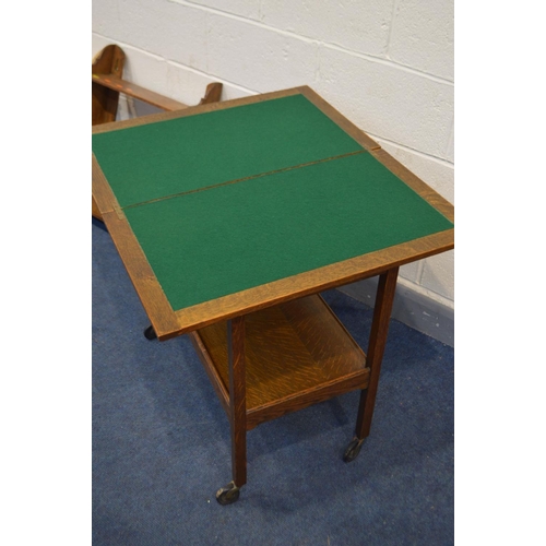 1247 - AN OAK CARD TABLE, the fold over top enclosing a green baize interior, containing a quantity of play... 