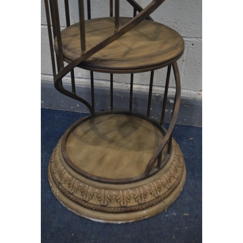 1257 - A CYLINDRICAL RESIN SHOP DISPLAY STAND, with a wrought iron gallery spiralling around three tier she... 