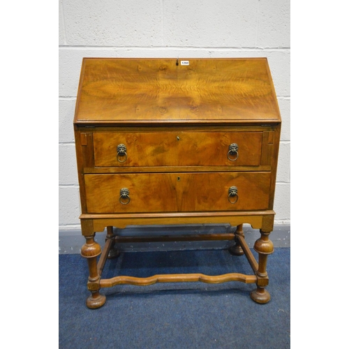 1260 - AN EARLY 20TH CENTURY WALNUT BUREAU, fall front door enclosing a fitted interior, above two drawers ... 