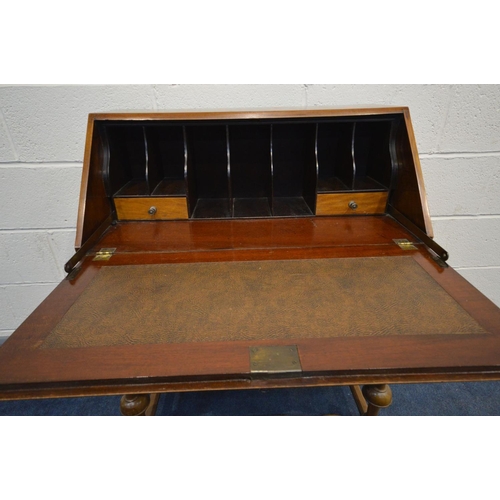 1260 - AN EARLY 20TH CENTURY WALNUT BUREAU, fall front door enclosing a fitted interior, above two drawers ... 