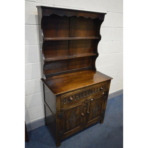 1272 - A LATE 20TH CENTURY OAK DRESSER, two plate racks above a single long drawer and two cupboard doors, ... 