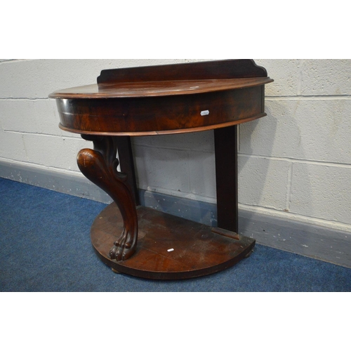 1285 - A VICTORIAN MAHOGANY DEMI LUNE DUCHESS WASHSTAND, with a raised back, supported by a central mythica... 