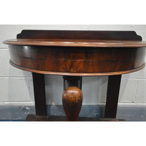 1285 - A VICTORIAN MAHOGANY DEMI LUNE DUCHESS WASHSTAND, with a raised back, supported by a central mythica... 