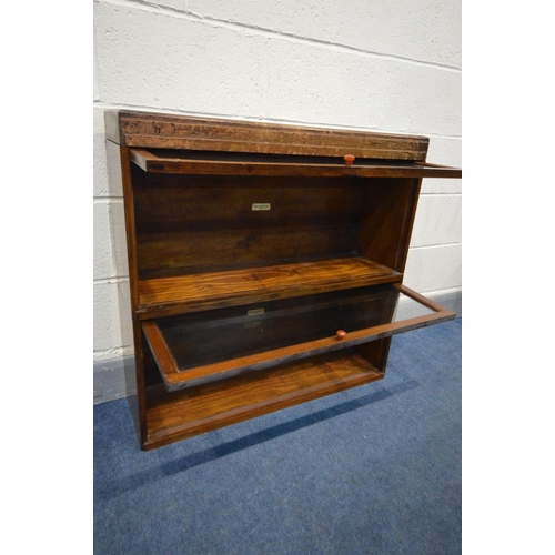 1286 - A GLOBE WERNICKE AND CO OAK TWO SECTION BOOKCASE, with glazed fall front doors, width 85cm x depth 2... 