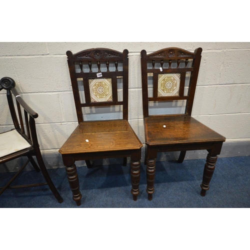 1289 - A PAIR OF EDWARDIAN OAK CHAIRS, with spindles below arched top rail, square ceramic panel to splat, ... 