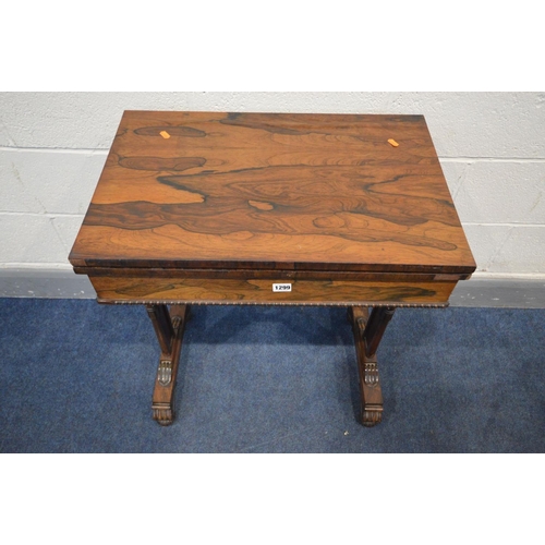 1299 - A REGENCY ROSEWOOD CARD TABLE, the fold over top enclosing an oval baize playing surface, single fri... 