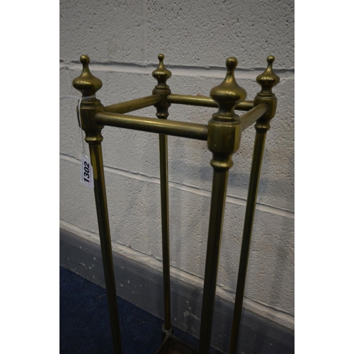 1302 - A  BRASS UMBRELLA/STICK STAND with a cast iron base, 18cm squared x height 64cm