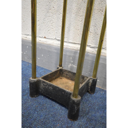 1302 - A  BRASS UMBRELLA/STICK STAND with a cast iron base, 18cm squared x height 64cm