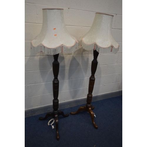 1304 - A PAIR OF EDWARDIAN MAHOGANY CONVERTED STANDARD LAMPS, on tripod legs, with fabric shades, height 14... 