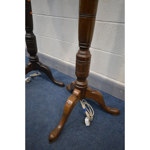 1304 - A PAIR OF EDWARDIAN MAHOGANY CONVERTED STANDARD LAMPS, on tripod legs, with fabric shades, height 14... 