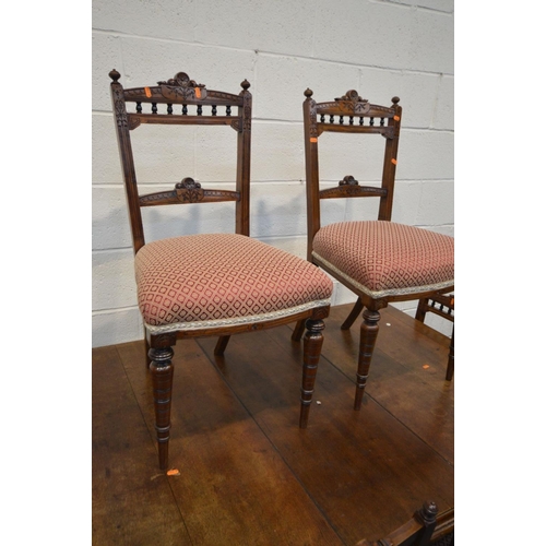 1306 - AN EDWARDIAN OAK WIND OUT DINING TABLE, with a single leaf, later fitted waiter's bell, on turned le... 