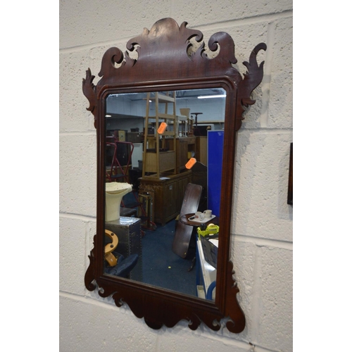 1312 - A GEORGIAN MAHOGANY FRETWORK WALL MIRROR, 42cm x 71cm along with an oak wall mirror with a pediment ... 