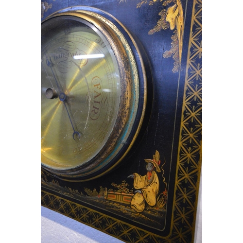 1326 - AN EBONISED ORIENTAL ANEROID BAROMETER, with chinoiserie detail, 35cm x 39cm