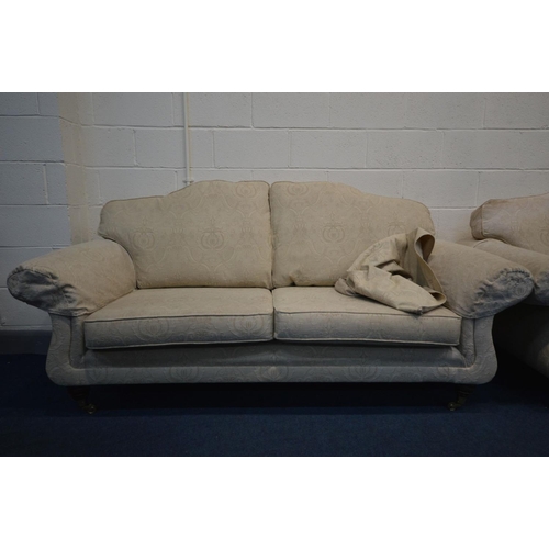 1337 - A CREAM UPHOLSTERED THREE PIECE LOUNGE SUITE, comprising two sized sofas, length 195cm and 149cm and... 