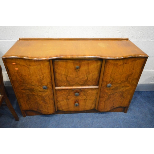 1376 - A 1940'S WALNUT DINING SUITE, comprising an draw leaf table, six chairs and a sideboard (8)