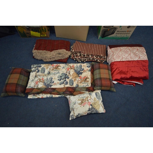 1390 - A COLLECTION OF BED THROWS/CUSHIONS, some matching sets, along with an Aston Martin car cover