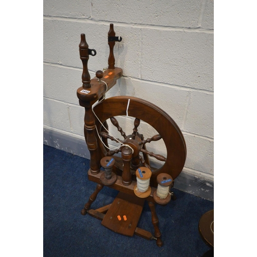 1410 - A LATE 20TH CENTURY HARDWOOD SPINNING WHEEL, with three rolls of cotton (missing one part) and an oa... 