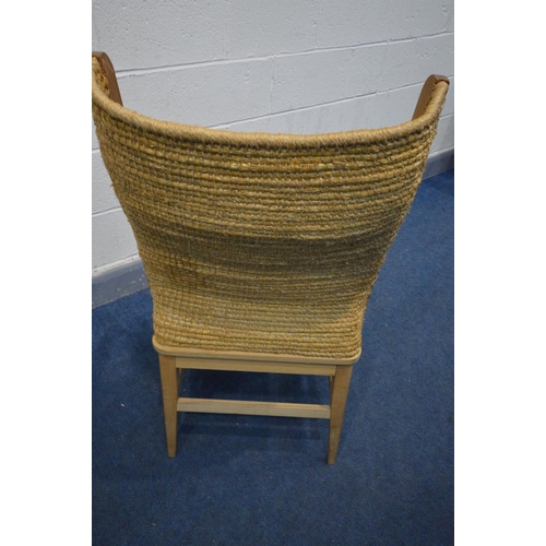 1415 - A LATE 20TH CENTURY BEECH ORKNEY CHAIR, woven wicker back and drop in seat pad, width inner width 48... 