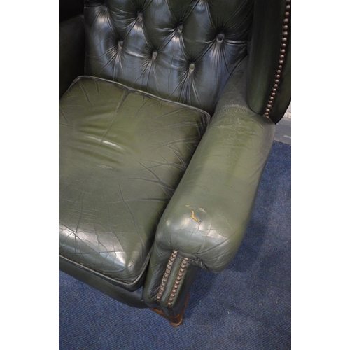 1423 - A GREEN LEATHER BUTTON BACK WINGBACK CHAIR on cabriole legs, width 90cm x depth 87cm x height 109cm ... 