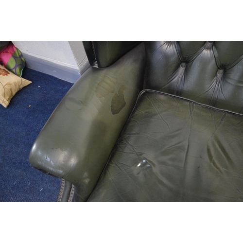 1424 - A GREEN LEATHER BUTTON BACK WINGBACK CHAIR on cabriole legs, width 90cm x depth 87cm x height 109cm ... 