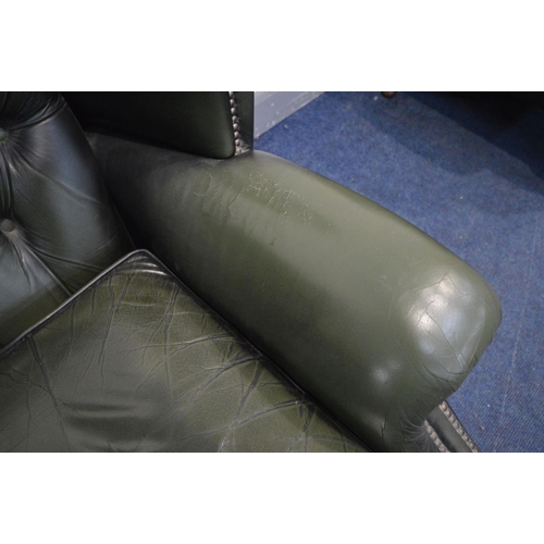 1424 - A GREEN LEATHER BUTTON BACK WINGBACK CHAIR on cabriole legs, width 90cm x depth 87cm x height 109cm ... 