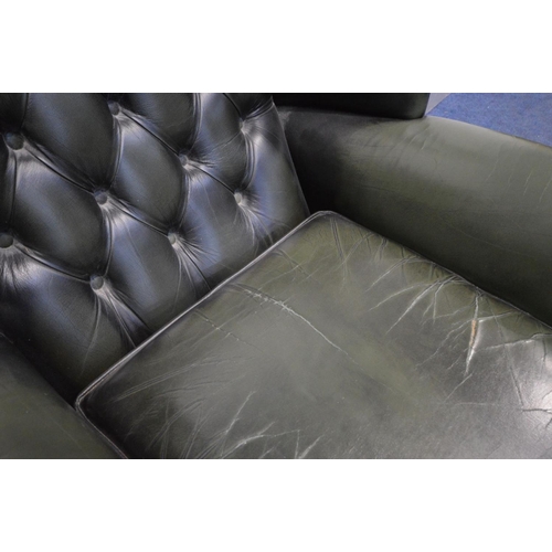 1425 - A GREEN LEATHER BUTTON BACK WINGBACK CHAIR on cabriole legs, width 90cm x depth 87cm x height 109cm ... 