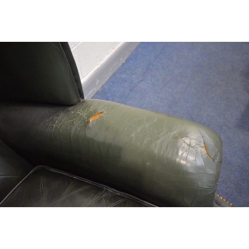 1426 - A GREEN LEATHER BUTTON BACK WINGBACK CHAIR on cabriole legs, width 90cm x depth 87cm x height 109cm ... 