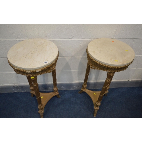 1437 - A PAIR OF 20TH CENTURY CIRCULAR GILTWOOD LOUIS XVI STYLE OCCASSIONAL TABLES, with marble tops, carvi... 