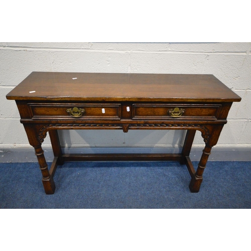 1453 - A TITCHMARSH AND GOODWIN OAK SIDE TABLE with two drawers, on turned and block legs united by side an... 