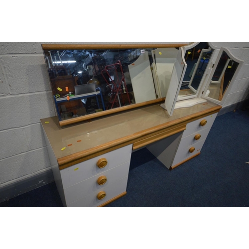 1455 - AN OAK AND PARTIALLY WHITE DRESSING TABLE, with seven drawers and a separate rectangular mirror on a... 