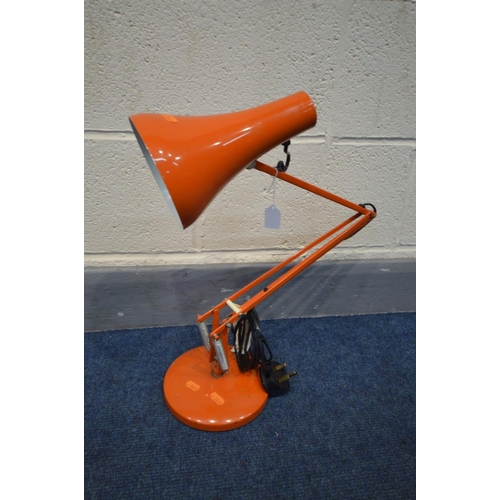 1457 - AN ORANGE ANGLE POISE DESK LAMP