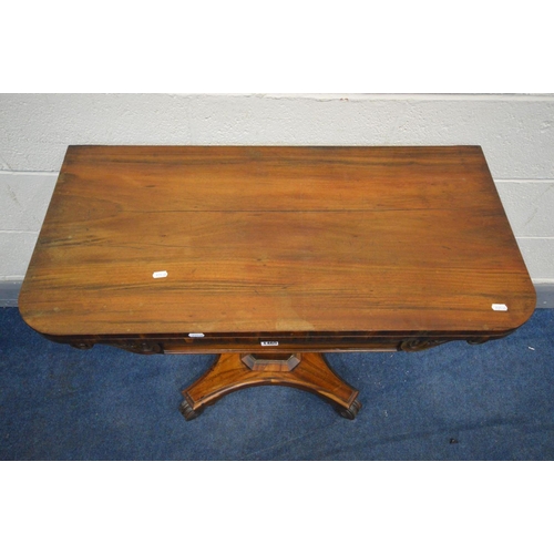 1465 - A VICTORIAN ROSEWOOD CARD TABLE, the fold over top enclosing a green baized playing surface, on a sq... 