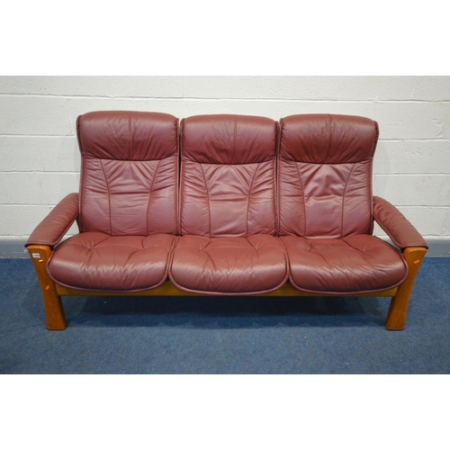 1479 - AN EKORNES STRESSES BURGUNDY LEATHER RECLINING SOFA, inner width 170cm x outer length 196cm