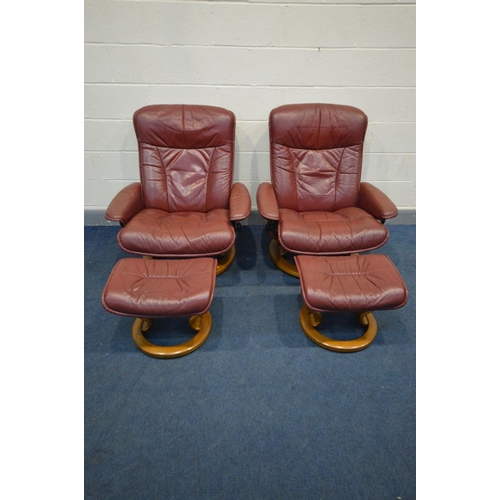 1480 - A PAIR OF EKORNES STRESSLESS BURGUNDY LEATHER RECLINING SWIVEL ARMCHAIRS and matching footstools (4)