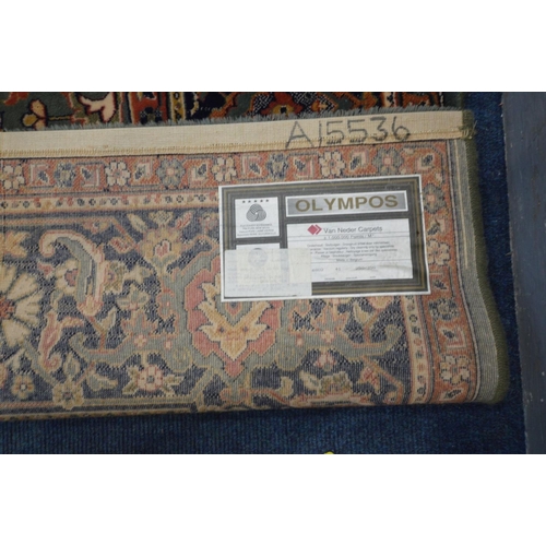 1486 - A LARGE WOOLLEN TABRIZ STYLE CARPET SQUARE, 346cm x 250cm and a pink tekke rug and a red rug (3)