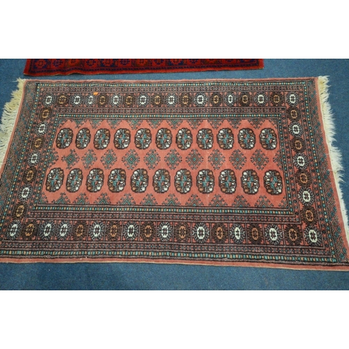 1486 - A LARGE WOOLLEN TABRIZ STYLE CARPET SQUARE, 346cm x 250cm and a pink tekke rug and a red rug (3)