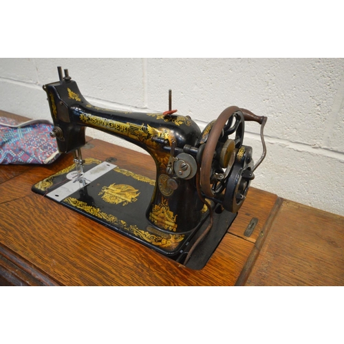 1502 - A SINGER TREDLE SEWING MACHINE