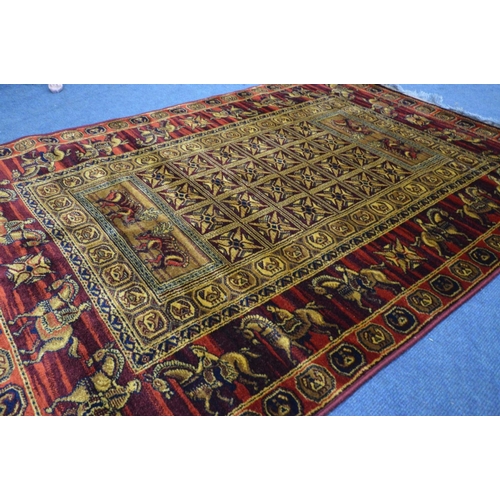 1509 - A LAHORE RED AND GOLD GROUND RUG, 198cm x 134cm