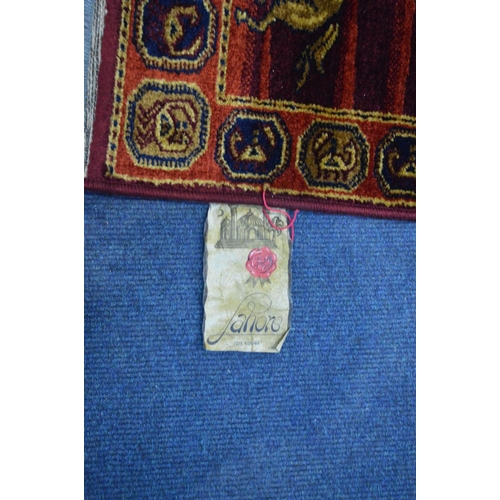 1509 - A LAHORE RED AND GOLD GROUND RUG, 198cm x 134cm