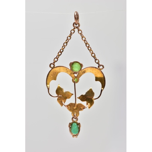 104 - A YELLOW METAL EDWARDIAN PENDANT, of an openwork floral design, set with seed pearls and green stone... 