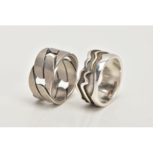 110 - TWO SILVER WIDE BAND RINGS, to include a textured wavy designed wide band, approximate width 11.1mm,... 